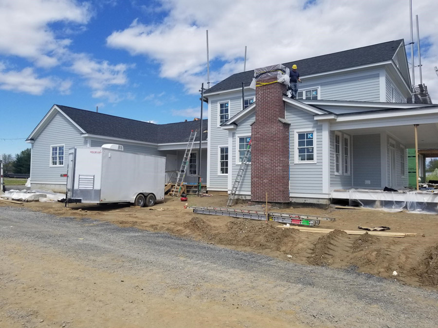 View of The Baldwin model home with attached garage in the back