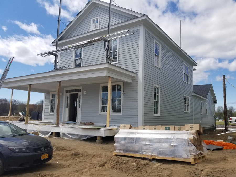 The Baldwin Model home under construction from the front and side view